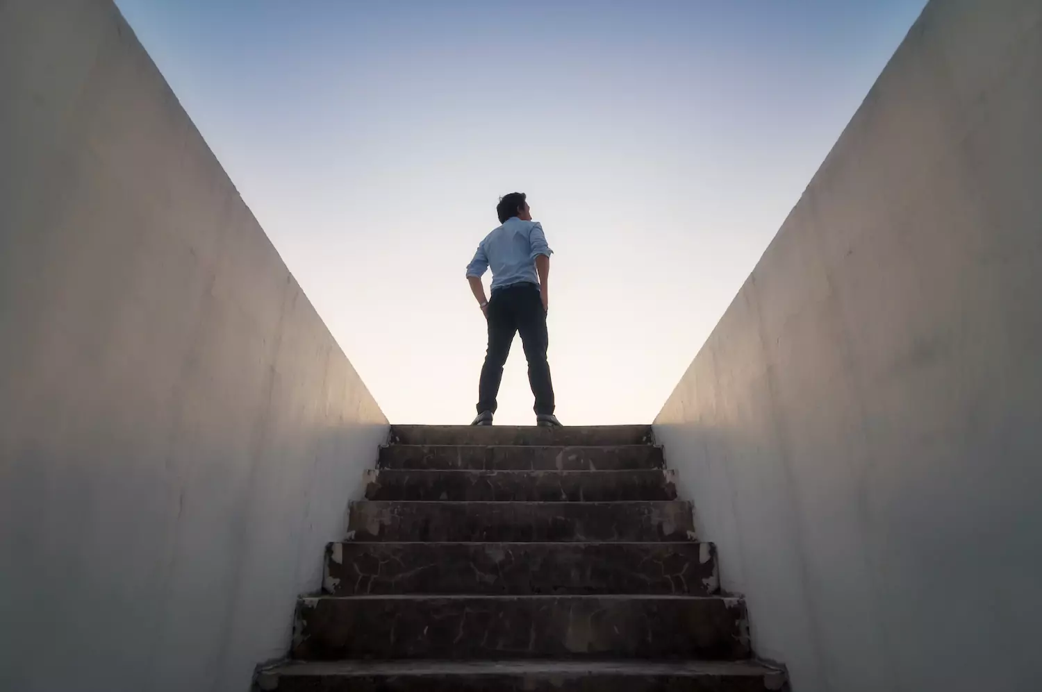 Man standing at the top of steps