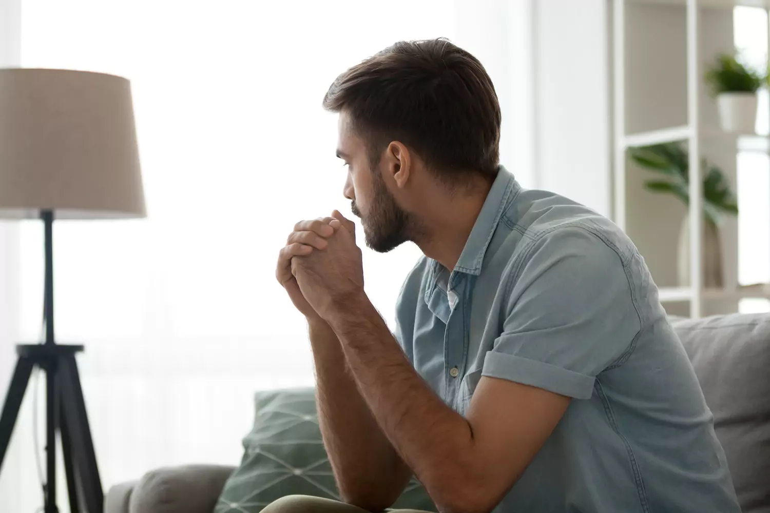 Man looking out the window