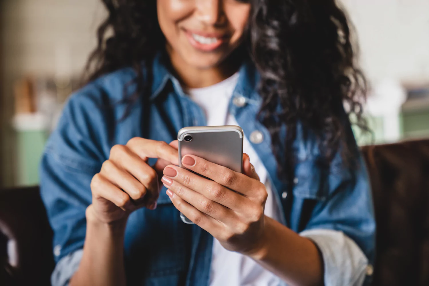 a woman scrolls on her phone considering online dating